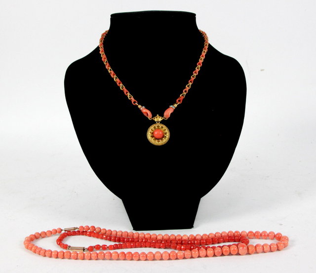 A Victorian pendant centred by a