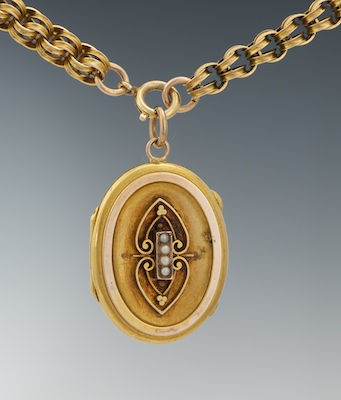 A Victorian Rolled Gold Locket on