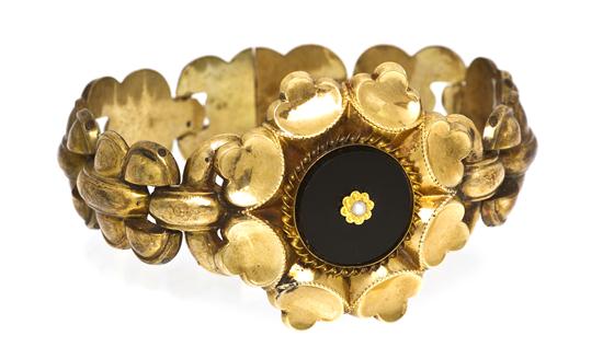 *A Victorian Rolled Gold Onyx and