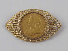 A Victorian sovereign in 9 ct. gold