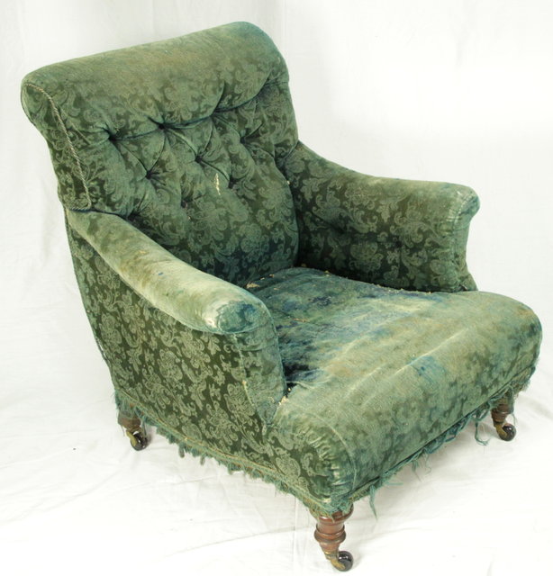 A Victorian upholstered armchair on