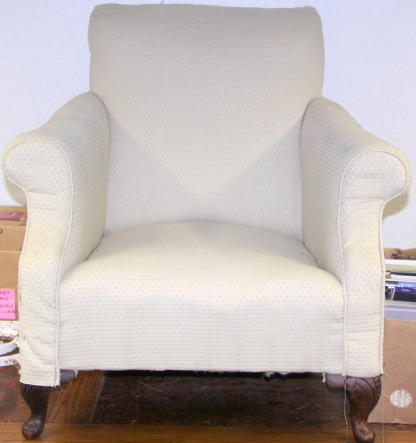 A Victorian upholstered armchair on