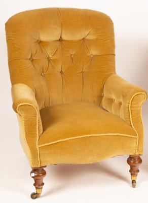 A Victorian upholstered armchair on