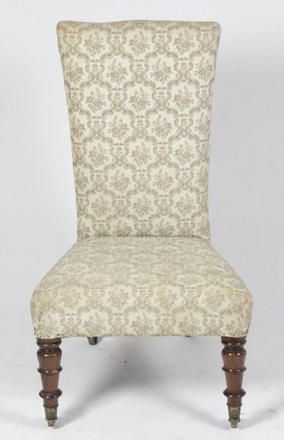 A Victorian upholstered chair on