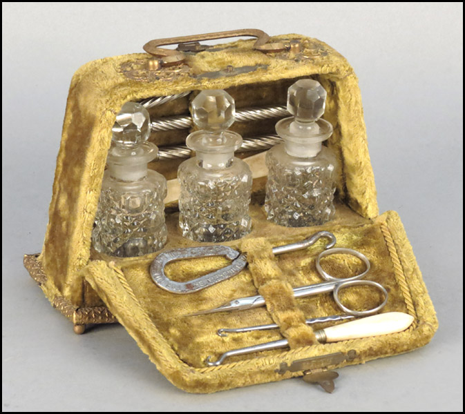 A VICTORIAN VELVET TRAVELING BOX.