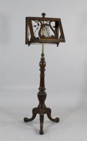 A Victorian walnut duet stand