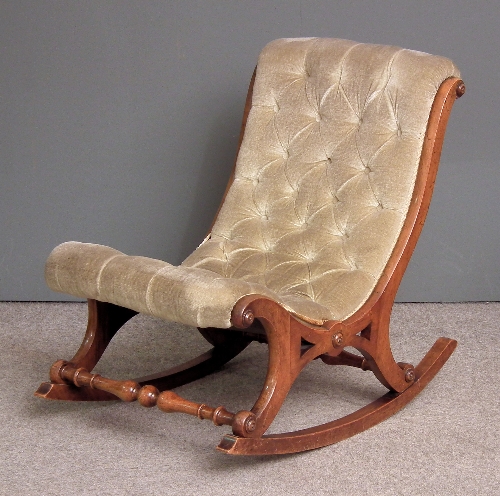 A Victorian walnut framed rocking