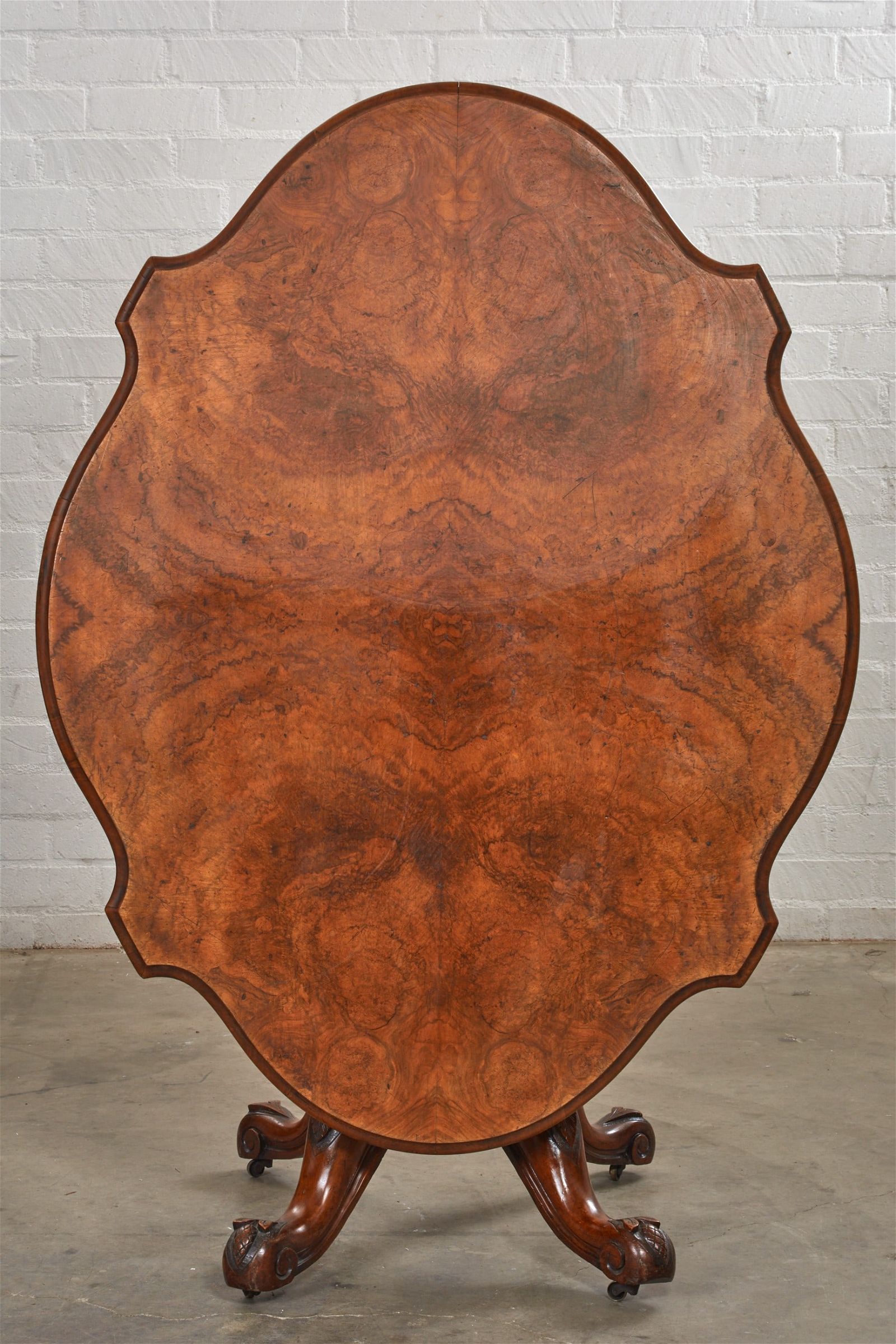 A VICTORIAN WALNUT TILT TOP