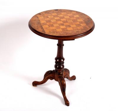 A Victorian walnut tripod games
