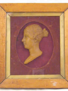 A Victorian wax portrait of a young
