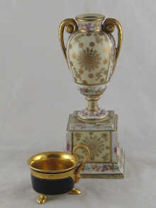 A Viennese ceramic urn on a