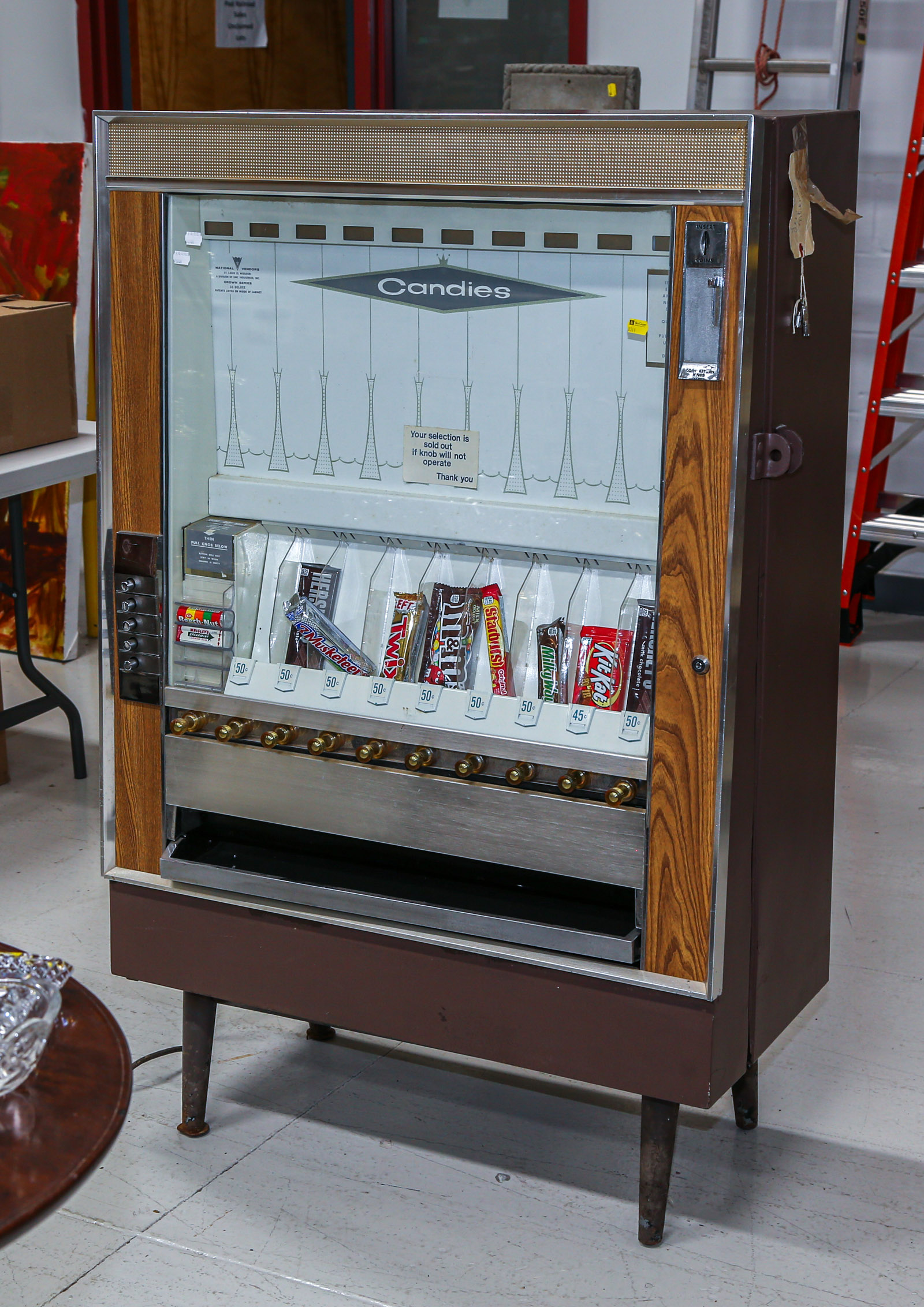 A VINTAGE CANDY VENDING MACHINE