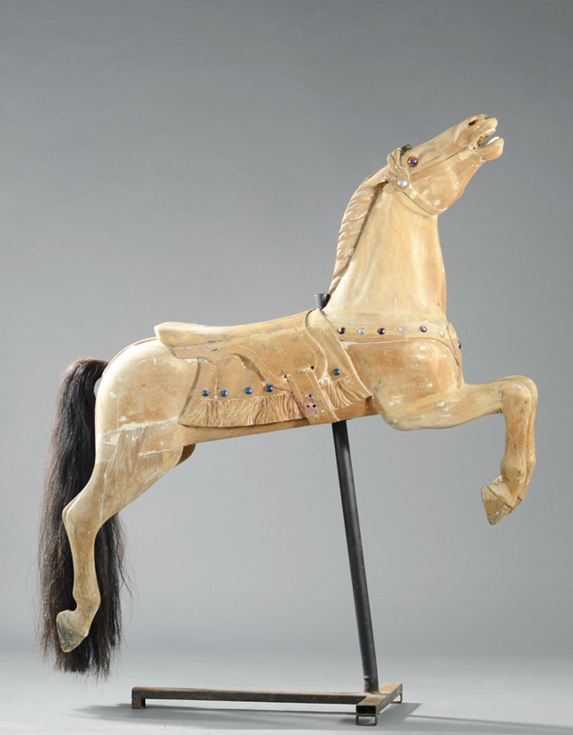 A VINTAGE CARVED AND UNPAINTED