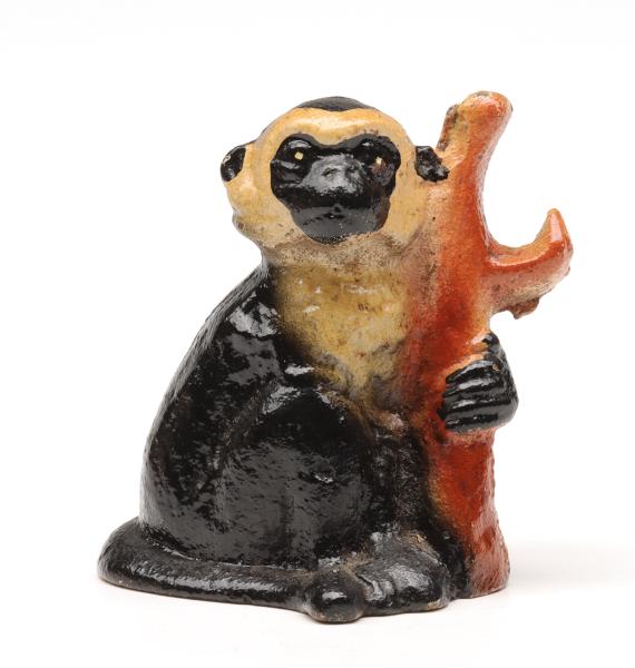 A VINTAGE FIGURAL IRON BOTTLE