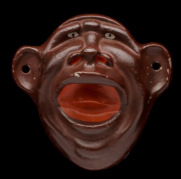 A VINTAGE FIGURAL WALL MOUNT BOTTLE