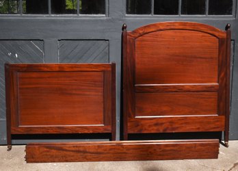 A vintage full size mahogany bed
