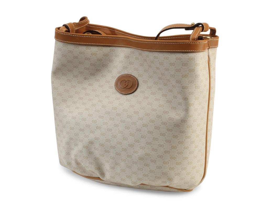 A VINTAGE GUCCI MONOGRAM CANVAS AND