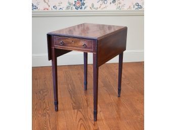 A vintage inlaid mahogany drop leaf