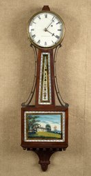 A vintage mahogany case banjo clock