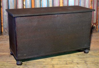 A vintage mahogany lift-top storage