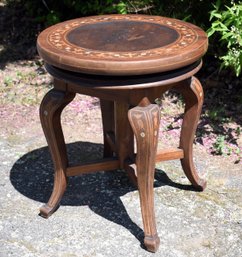 A vintage mahogany swiveling