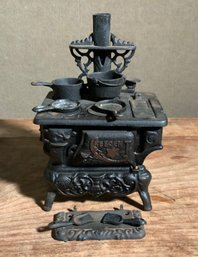 A vintage miniature cast iron