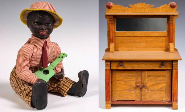 A VINTAGE MUSICAL BLACK RUBBER DOLL