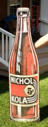 A vintage Nichol Kola tin bott