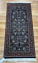 A vintage Oriental scatter rug with