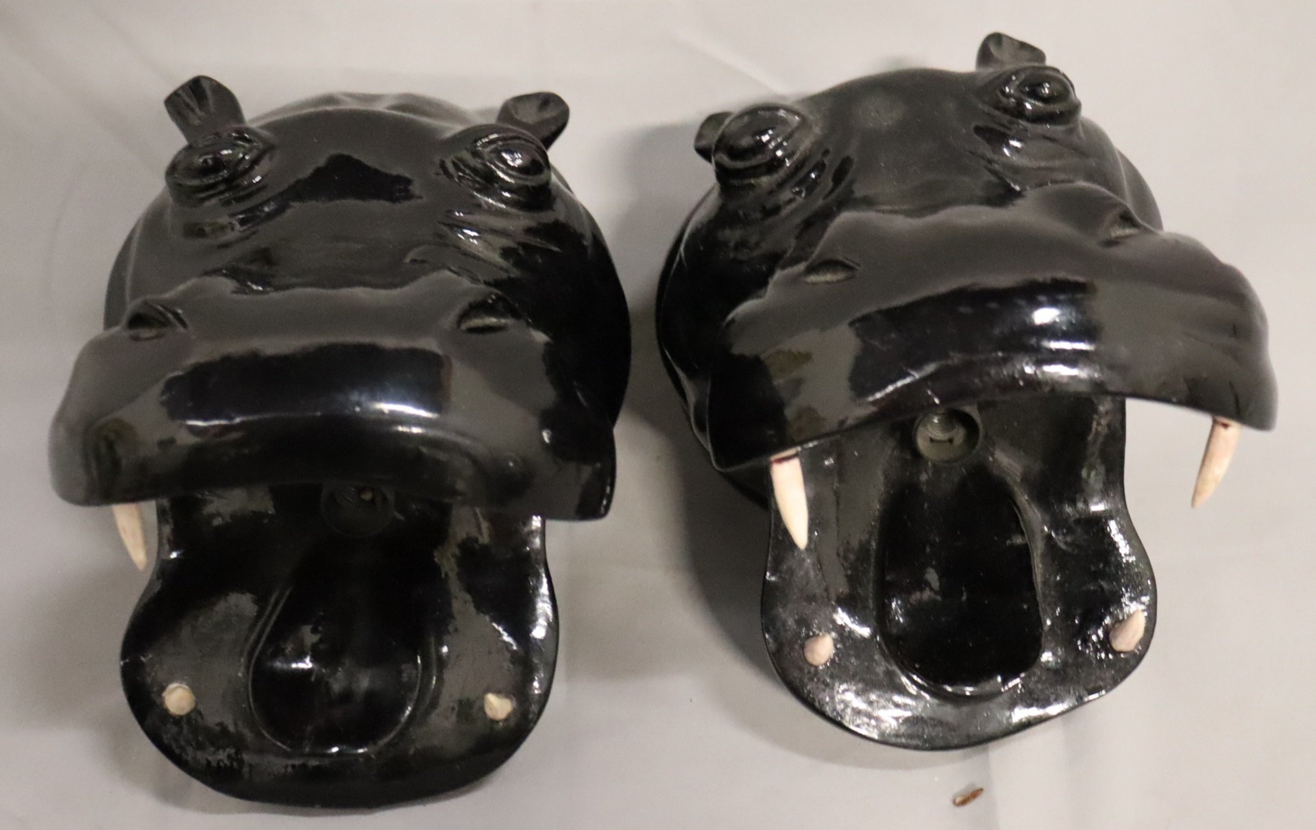 A VINTAGE PAIR OF EBONISED WOOD