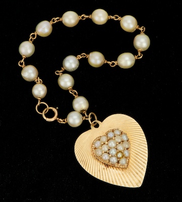 A Vintage Pearl and Gold Charm