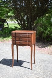 A vintage three drawer John Wi