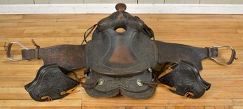 A vintage tooled leather saddle