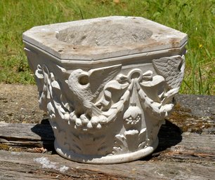 A vintage white painted stone