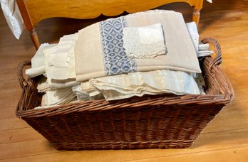 A vintage wicker hamper basket with