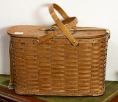 A VINTAGE WICKER PICNIC BASKET