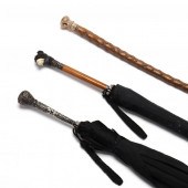 A WALKING STICK AND TWO UMBREL