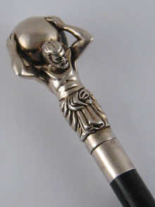 A walking stick the silver top a