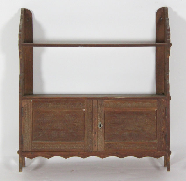 A wall hanging cabinet with shelf