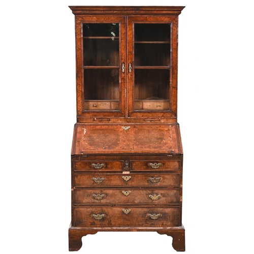 A walnut bureau-cabinet, with
