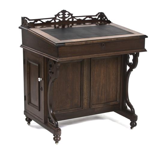 A Walnut Davenport Desk having a