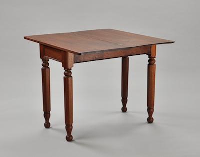A Walnut Flip Top Game Table With a