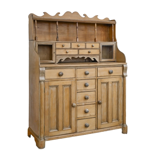 A waxed pine dresser, the upper