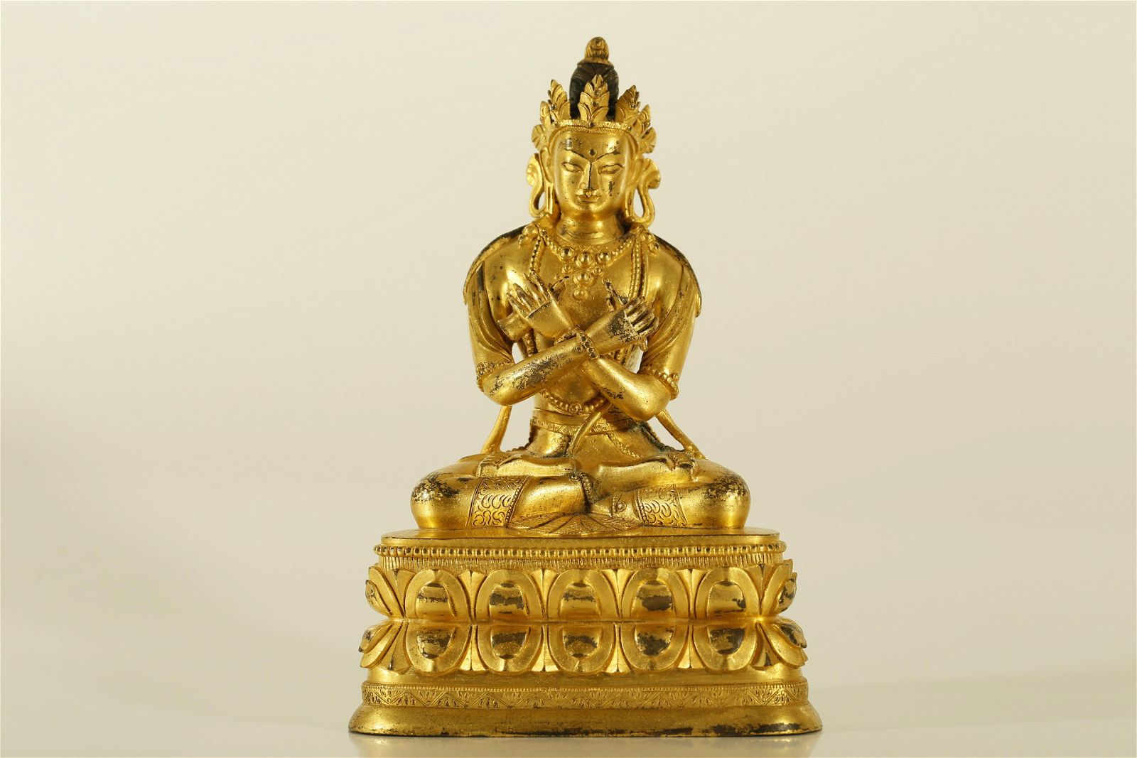 A WELL-CAST GILT-BRONZE FIGURE OF