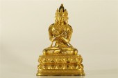 A WELL-CAST GILT-BRONZE FIGURE
