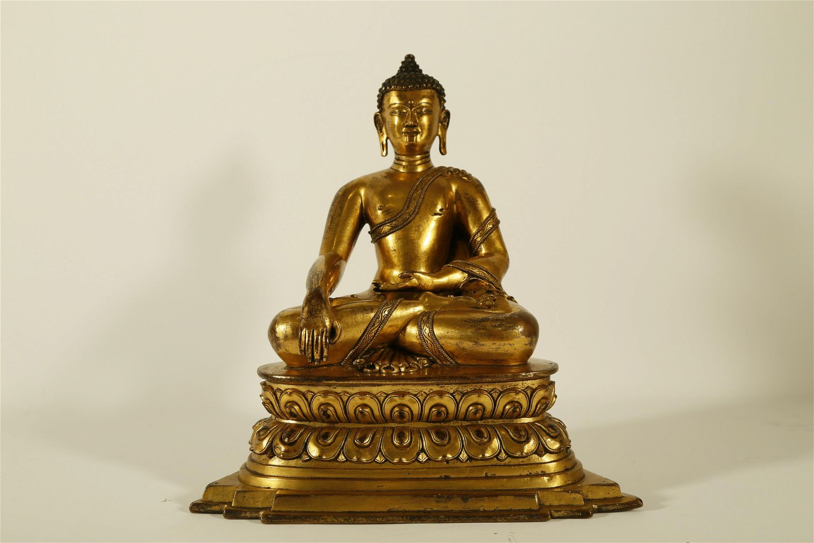 A WELL-CAST GILT-BRONZE FIGURE OF