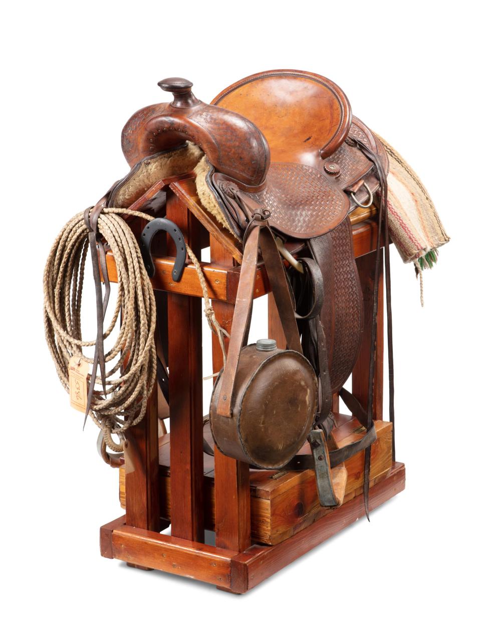 A WESTERN ROPING SADDLE, BY