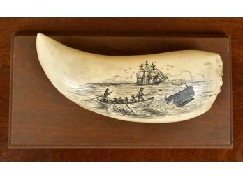 A whale's tooth with vintage 20th