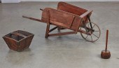 A WHEELBARROW WITH A WOOD BUCK