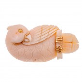 A WHIMSICAL CARVED CORAL COCKA